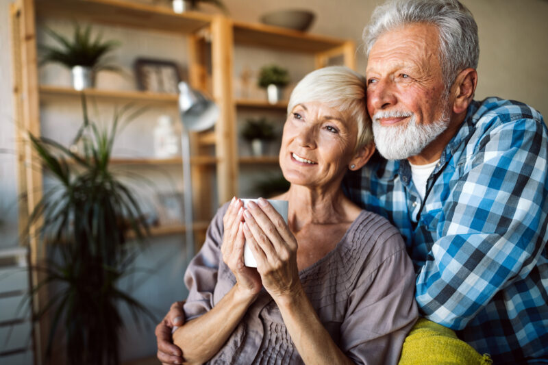 Couple looking out of window