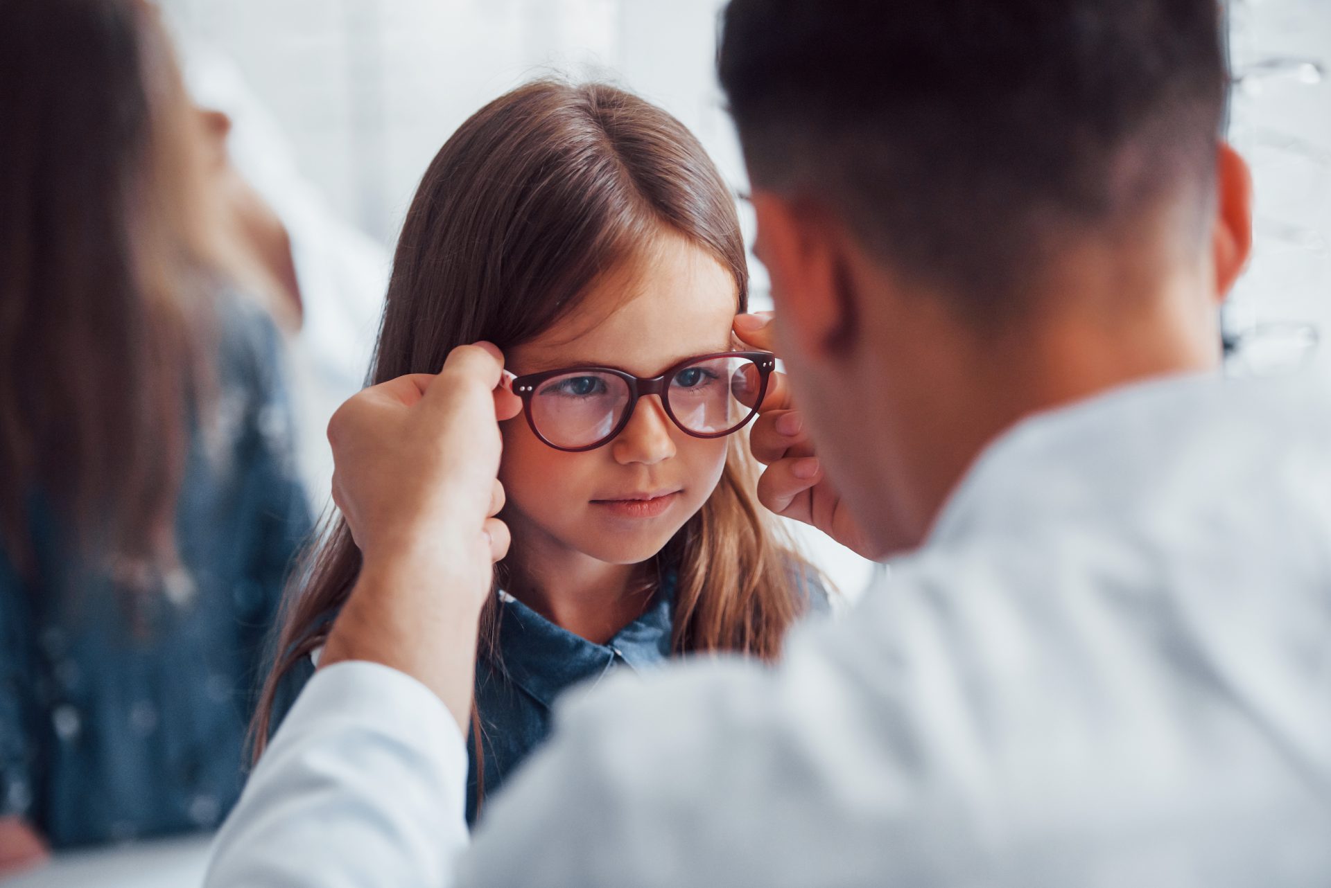 A child trying on some glasses